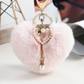 Pink plush heart keychain with pearl accents and gold-tone metal clip for bags - Pink
