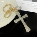Sparkling gold cross keychain with rhinestones and crystal drop for handbags - Gold