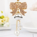 Champagne bow keychain with a large white pearl and elegant ribbon detail on gold alloy - Full Rhinestone Bow - Champagne