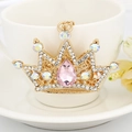 Golden crown keychain featuring a pink pear-shaped gem and colorful crystal accents - Pink