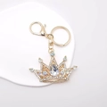 Golden crystal crown keychain with iridescent rhinestones and teardrop pendant - White