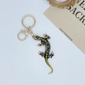 Portachiavi lucertola con strass verdi e grigi scintillanti in una finitura oro vintage - Marrone Grigio