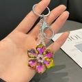 Iridescent crystal snowflake keychain with silver lobster clasp and colorful petals - Pink