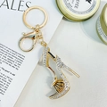 Goldener High Heel Schlüsselanhänger mit Strass und Blumendetail für Handtaschen - Weiß