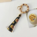 Llavero de pulsera de cable con borla de leopardo y dije de girasol en amarillo - Girasol