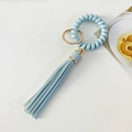 Sky blue spiral wristlet keychain with matching PU leather tassel and gold ring - Light Blue