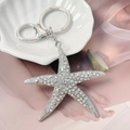 Llavero de estrella de mar plateado con diamantes de imitación y cierre de langosta - Plateado