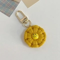 Portachiavi girasole fatto a mano all'uncinetto con faccina gialla sorridente - Giallo zenzero