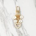 Golden keychain with LOVE enamel letters and heart pearl pendant accessory - Four Letters Style