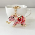 Pink rhinestone elephant keychain with red heart detail and golden spring buckle - Pink