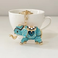 Exotic blue rhinestone elephant keychain with gold finish and blue heart detail - Blue