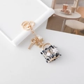 Golden flower tweed bag charm keychain with faux pearls and elegant metallic key pendant - Black