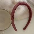 Elegant wine red velvet headband with a white pearl and gold base on a soft background - Rose Red