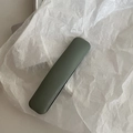 Green leather protective sleeve for stylus or pens on white textured paper - Green