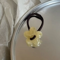 Cute jelly yellow flower hair tie with high elastic black rubber band on silver tray - Creamy Yellow Flower Hair Tie