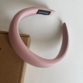Detail showing the inner black HAND MADE label on a thick pink padded sponge headband - Bright Pink
