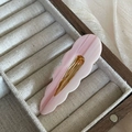 Detail shot of a pink marble acetate hair clip with gold metal base in a jewelry box - Wavy Cloud Duckbill Clip (5#) / Purple Textured