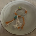 Handmade woven bracelet with green jade donut, silver flower charm, and white tassel - White (Orange White Patchwork Rope Bracelet)