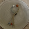 Detail of hand-woven bracelet with light blue beads and orange accent in ethnic style - Light Blue (Orange White Beads Patchwork Pendant Bracelet)