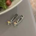 Set of two silver star hair clips with iridescent crystals in a lifestyle setting - Holographic Five-Pointed Star Style / Silver