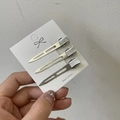 Set di tre fermagli per capelli in metallo argentato per volume e styling su cartoncino - Argento
