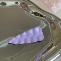 Purple wavy candy color seamless hair clip on a silver metal display tray for women - Purple Textured Triangle