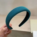 Close-up of cyan sponge headband showing premium twill fabric texture and black inner lining - Lake Blue