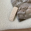 Close-up of a beige quilted leather hair clip with elegant French vintage style - Off-white Leather BB Clip