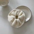 Creamy beige knitted crochet hair scrunchie shown on a minimalist ceramic plate - 6# Creamy White