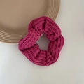Detail of deep pink knit scrunchie showing soft ribbed texture and premium elastic band - Rose Red