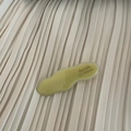Detailed close-up of wavy yellow acetate hair clip with golden Barrette La France text - Milky White Wave Style (7#)