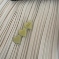 Detail of three acetate heart hair clips with Barrette La France text on fabric - Milky White Three Hearts Style (14#)