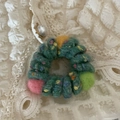 Detail of wool felt balls on dark green braided elastic hair tie with lace background - Green Colorful Telephone Cord Style
