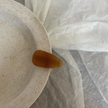 French acetate amber brown teardrop hair clip displayed on minimalist ceramic tray - Solid Tortoiseshell Triangle