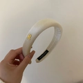 Elegant cream padded headband with gold metal R letter charm and smooth satin finish - White Headband / White Headband