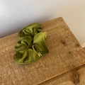 Detail of olive green velvet scrunchie with golden metal letter R pendant detail - Green Scrunchie / Green Scrunchie