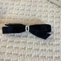 Detail of vintage black velvet bow hair clip with elegant double-row pearl accents - Pearl String Bow Hairpin