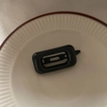 Detail of a black hollow rectangular BB hair clip on a minimalist ceramic plate - Rectangle Style / Black