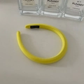 Thick padded sponge headband in vibrant yellow fabric with handmade label detail - Yellow