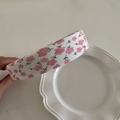 Close-up of floral fabric texture on a wide headband with pink flower patterns - White Pink Small Floral Green Leaves