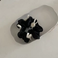 Detail of black organza scrunchie with white ribbon roses and bow on a ceramic tray - Black Mesh White Bow Hair Tie