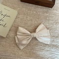 Elegant cream satin bow hair clip with sparkling silver rhinestones on knit fabric - White Bow With Rhinestones / White