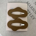 Matte brown cloud-shaped wave hair clips on card set against a textured grey background - 12# Matte Brown Wave Style