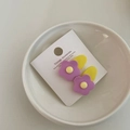 Pair of purple flower hair clips with yellow center on vintage white display card - Purple Flower Yellow Base