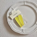 Set of two bright yellow matte jelly hair clips on a retail card in a ceramic dish - Yellow Matte / Yellow