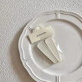Set of two matte cream jelly hair clips on a wavy white plate with accessories packaging - White Matte Hair Clips / White