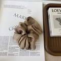 Macro detail of dark coffee silk satin scrunchie with elegant folds and glossy finish - Large / Coffee