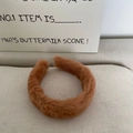 Close-up of soft khaki brown faux fur headband showing its fluffy texture and thickness - Caramel color