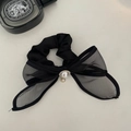 Detail of elegant black mesh bow scrunchie with sparkling rhinestone and pearl accents - Mesh Bow with Artificial Pearl Scrunchie / Black