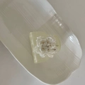 Macro detail of French flower hair claw clip with cream resin and golden pistil decoration - Frosted Green Small Arc Flower Style